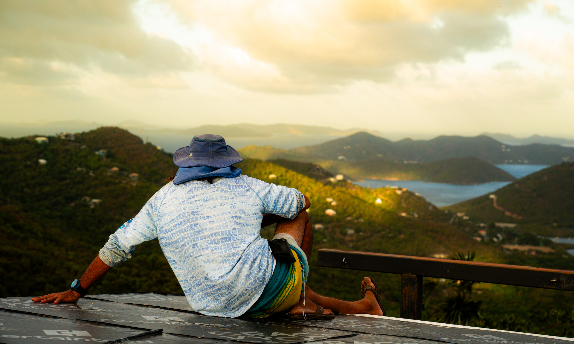 Visitor taking in the panoramic St. John island and sea view at sunset